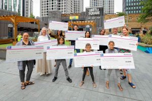 People holding cheques in Castle Square
